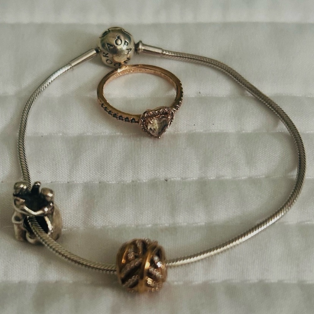 PANDORA bracelet with 1 silver charm,& 1 rose gold charm. Rose gold heart ring.
